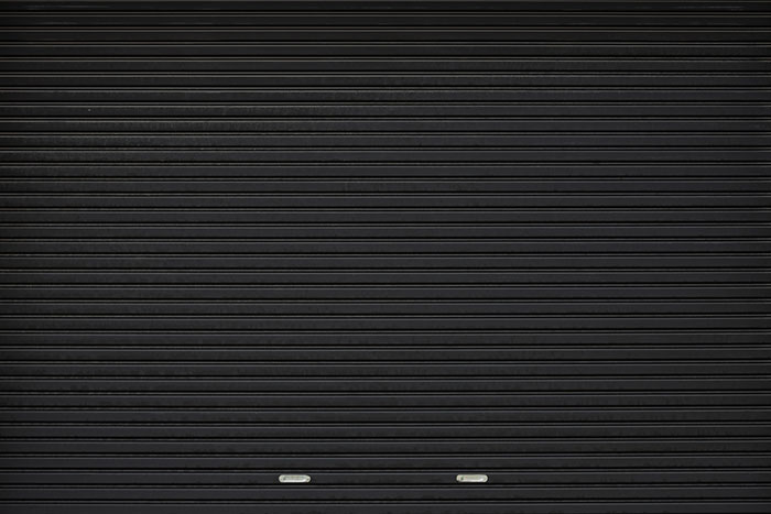 Black shutter door with stainless steel holder